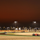 A photo of F1 cars racing in Qatar in 2021.